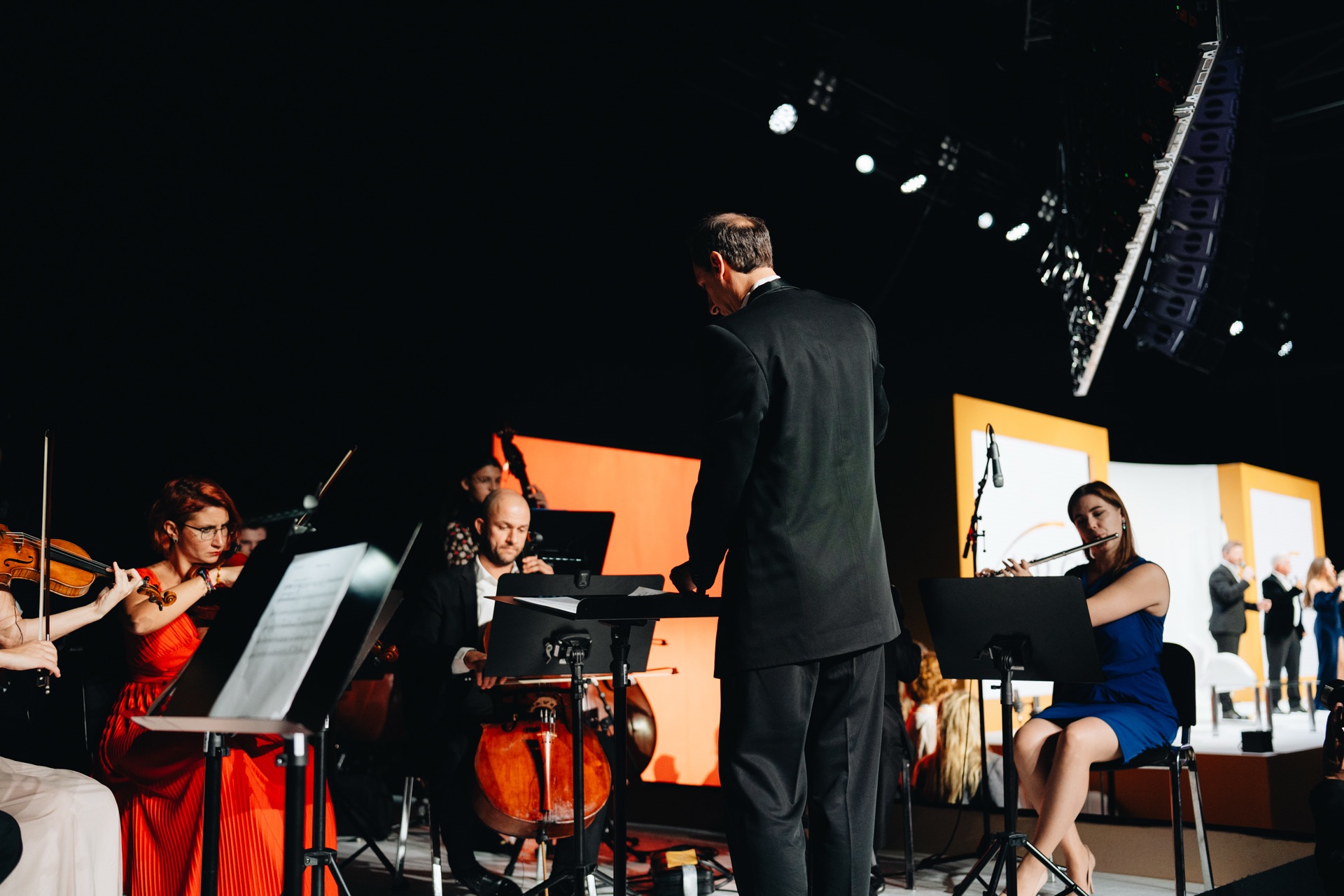Camerata Bulgarica musicians on the wide, lit main stage of an ARC conference edition